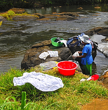 Laundry day by the river, Mauritius