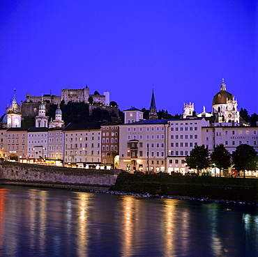 Lit-up facades in the historic centre at dusk, Salzach, Salzburg, Austria, Europe