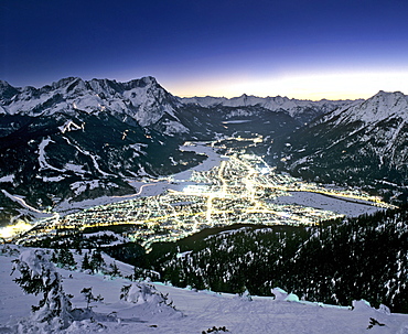 View from Mount Wank, night shot, Garmisch-Partenkirchen's town lights, Wetterstein Range, Werdenfels, Upper Bavaria, Bavaria, Germany