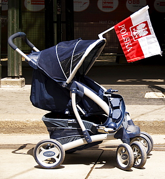 Polish flag attached to a baby carriage