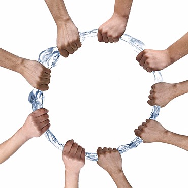 Several hands compass a ring of water