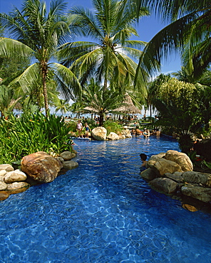 Swimming pool and palm trees at the Golden Sands Hotel in Penang, Malaysia, Southeast Asia, Asia