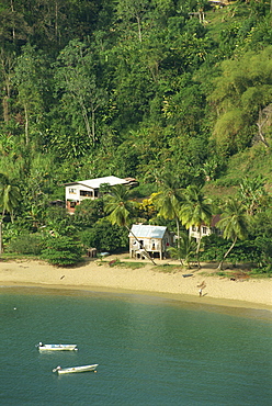 Aerial view over housing on beach in Parlatuvier Bay, Tobago, West Indies, Caribbean, Central America