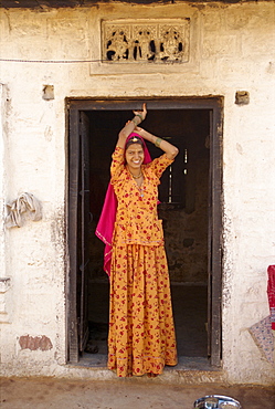 Woman in doorway of village house, near Jodhpur, Rajasthan state, India, Asia