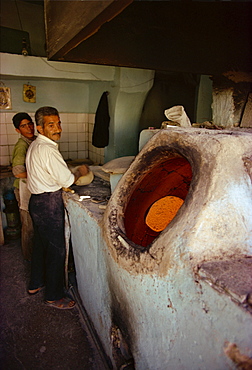 Men baking bread, Iran, Middle East