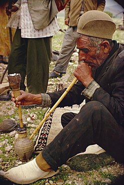 Qashqai man smoking, southern area, Iran, Middle East