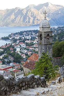 Kotor Old Town and fortifications at dawn with the Church of our Lady of Remedy in the foreground, Bay of Kotor, UNESCO World Heritage Site, Montenegro, Europe