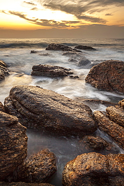 Long exposure of surf and rocks at sunrise, Tangalle, Sri Lanka, Indian Ocean, Asia 