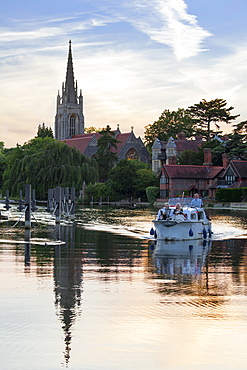 Group on boat with All Saints Church in the background, Marlow, Buckinghamshire, England, United Kingdom, Europe