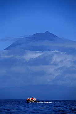 Pico Mountain and whale watchers on zodiac. Azores, Portugal, Atlantic