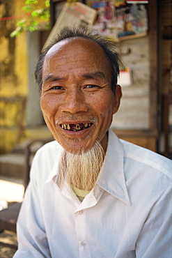 Portrait of a smiling man with a beard but few teeth in Vietnam, Indochina, Southeast Asia, Asia