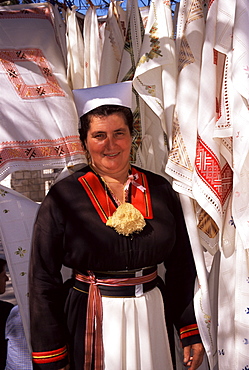 Stall holder in folk costume, Cilipi, Croatia, Europe