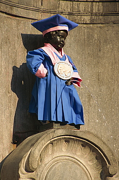 Manneken Pis statue dressed in garb of Brotherhood of Red Elephant, a brewery charity, Brussels, Belgium, Europe