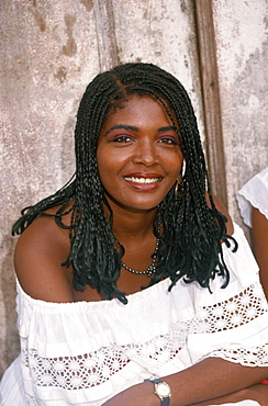 Portrait of a smiling woman with braided hair in Salvador, Brazil, South America