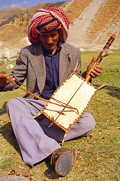 Man playing the rabala, Jordan, Middle East, Africa