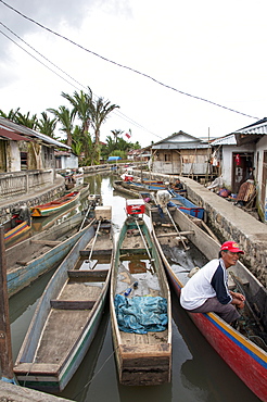 Fishing canoes in a stream leading to Tondano Lake, Sulawesi, Indonesia, Southeast Asia, Asia