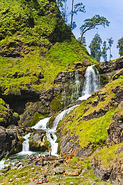 Tourists swimming in hot pools and waterfalls on Mount Rinjani volcano crater, Lombok, Indonesia, Southeast Asia, Asia