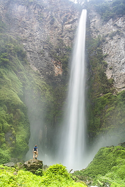 Tourist at 120m Sipisopiso Waterfall, Lake Toba (Danau Toba), North Sumatra, Indonesia, Southeast Asia, Asia