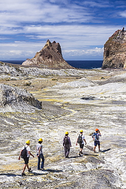 Tourists exploring White Island Volcano, an active volcano in the Bay of Plenty, North Island, New Zealand, Pacific