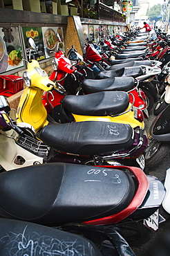 Hundreds of mopeds in a typical street scene in Ho Chi Minh City (Saigon), Vietnam, Indochina, Southeast Asia, Asia