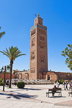 Moroccan man sat on a bench in front of Koutoubia Mosque, Marrakech, Morocco, North Africa, Africa 