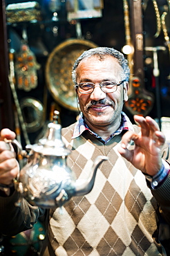 Moroccan teapot vendor in Marrakech souk and market, Morocco, North Africa, Africa