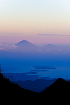 Sunset over Mount Agung and Mount Batur on Bali, and the Three Gili Isles taken from Mount Rinjani, Lombok, Indonesia, Southeast Asia, Asia