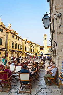 Stradun, the famous street in Dubrovnik, tourists in a cafe by the City Bell Tower, Old Town, UNESCO World Heritage Site, Dubrovnik, Dalmatia, Croatia, Europe