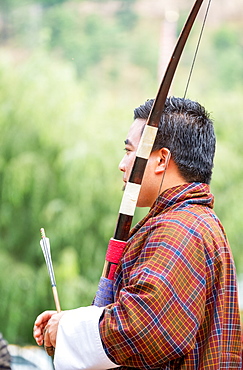 Portrait of man at archery competition, Bhutan's national sport, Bhutan, Asia