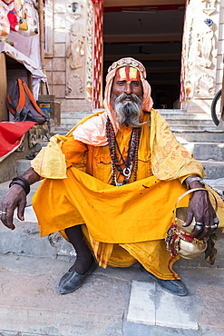 Portrait of Sadhu in orange robes in Pushkar, Rajasthan, India, Asia