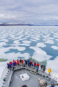 The Lindblad Expeditions ship National Geographic Explorer in Shorefast ice, Maxwell Bay, Devon Island, Nunavut, Canada, North America