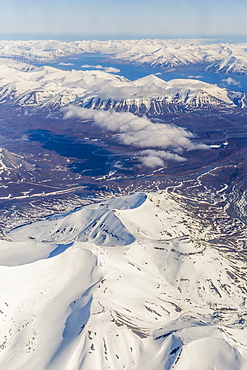 Aerial view of mountains, glaciers and ice fields on the west coast of Spitsbergen on a commercial flight from Longyearbyen to Oslo, Svalbard, Norway, Scandinavia, Europe