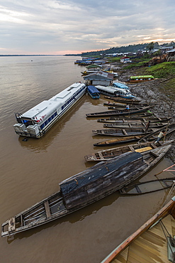 Various boats along the banks of the Amazon River, Loreto, Peru, South America