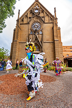 Santa Fe Indian Market participants in traditional regalia perform in downtown Santa Fe, New Mexico, United States of America, North America