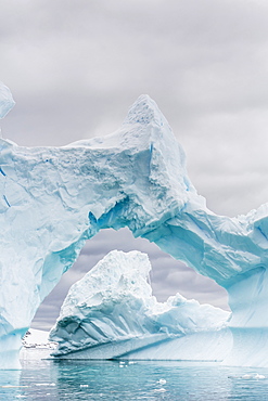 Huge arched iceberg near Petermann Island, western side of the Antarctic Peninsula, Southern Ocean, Polar Regions