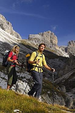 Hikers in the mountains under blue sky, Rosengarten, Dolomites, South Tyrol, Italy, Europe