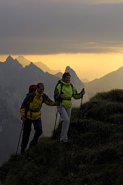 Hikers at ascent to the Klammspitze in the evening, Klammspitze, Ammergau Alps, Bavaria, Germany, Europe