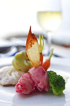 Coloured seafood and vegetables with white wine at sunset, reaturant above the sea, Hotel Jetwing Lighthouse, Southwest coast, Sri Lanka