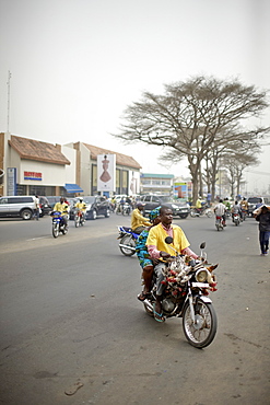 Zemidjans motorcycle taxi on the way to market, Ganxi, Cotonou, Benin