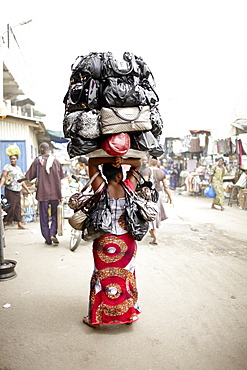 Woman selling handbags at Dantokpa market, Cotonou, Littoral Department, Benin