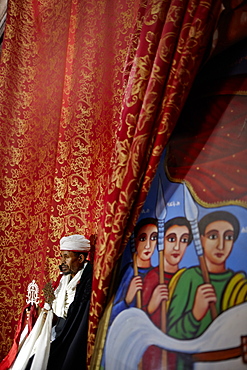 Priest holding Lalibela cross, Church of Saint George, Lalibela, Amhara region, Ethiopia