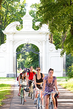 Cyclists near Adlertor, entrance to Keesscher Park, Markkleeberg, Saxony, Germany