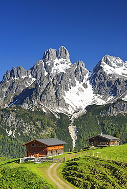 Alpine hut with mount Bischofsmuetze in background, Sulzenalm, Dachstein Mountains, Salzburg, Austria