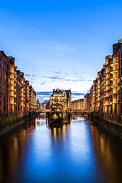 view to the Watercastle in the old Speicherstadt in the twilight, Hafencity of Hamburg, north Germany, Germany