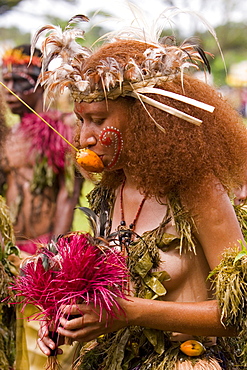 Young woman wearing traditional costume and headdress at Singsing Dance, Lae, Papue New Guinea, Oceania