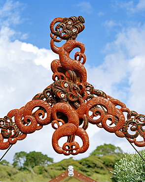 Traditional Maori wood carvings at the entrance of Marae Papatea, North coast, Eastcape, North Island, New Zealand