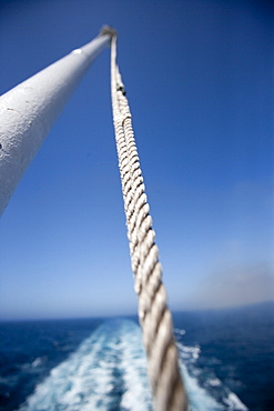 Flagpole at the stern of the ship with backwash, cruise liner, Queen Mary 2, Atlantic ocean, Transatlantic