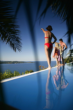 Family on poolside, Bay of Porto Vecchio, Southern Corse, France