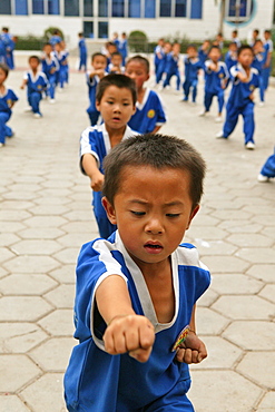 Kung Fu training at kindergarten age, at one of the many new Kung Fu schools in Dengfeng, school near Shaolin, Song Shan, Henan province, China, Asia