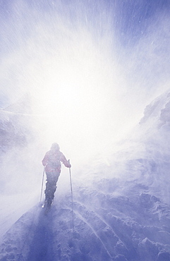 Back country skier at Posets in blizzard, Pyrenees, Spain